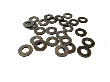 Assorted black rubber washers in various sizes